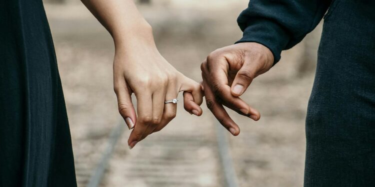 couple hands wedding rings