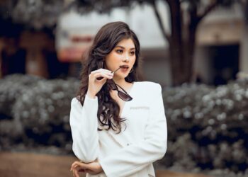 woman styling white top