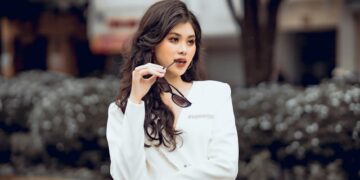 woman styling white top