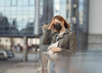 woman wearing black leather mini skirt